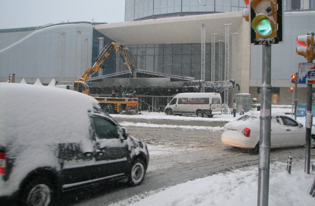 Workers putting up a stage in front of Akmerkez shopping center for a New Year show.